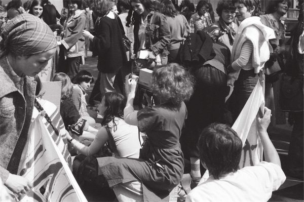 Catherine Bernheim, ‘Delphine Seyrig holding a camera during the shooting of Où est-ce qu’on se mai? [Where do we May?], shot in Paris during the May Day demonstration of 1976’ (1976) photograph. Credit: 20 minutos.